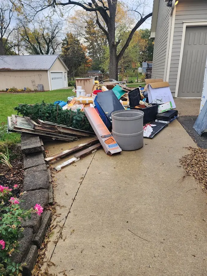 Dumpster being loaded with debris for Residential Dumpster Rental in Peralta